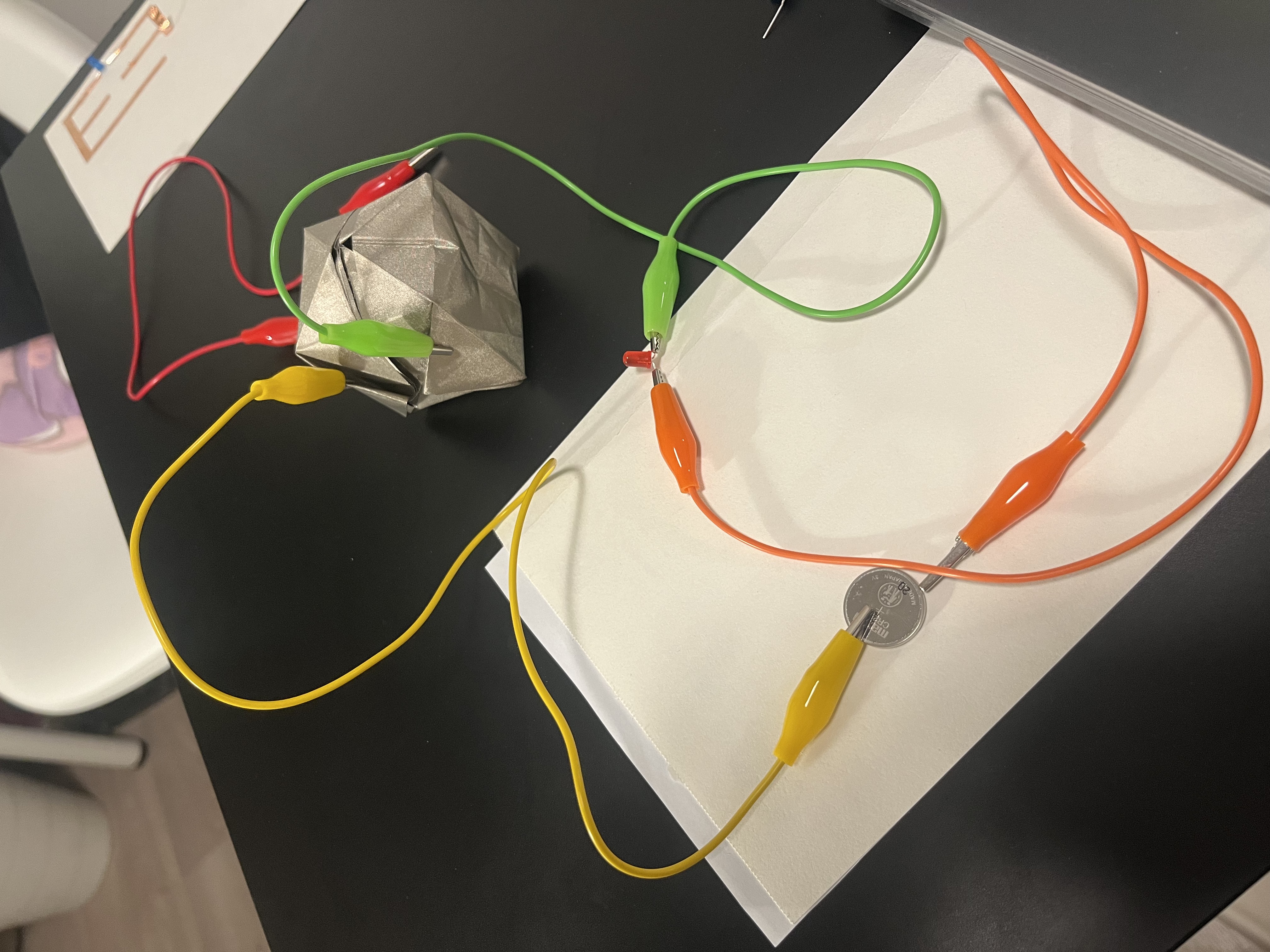Reversing battery polarity to observe the effect on circuit functionality, resulting in failure.