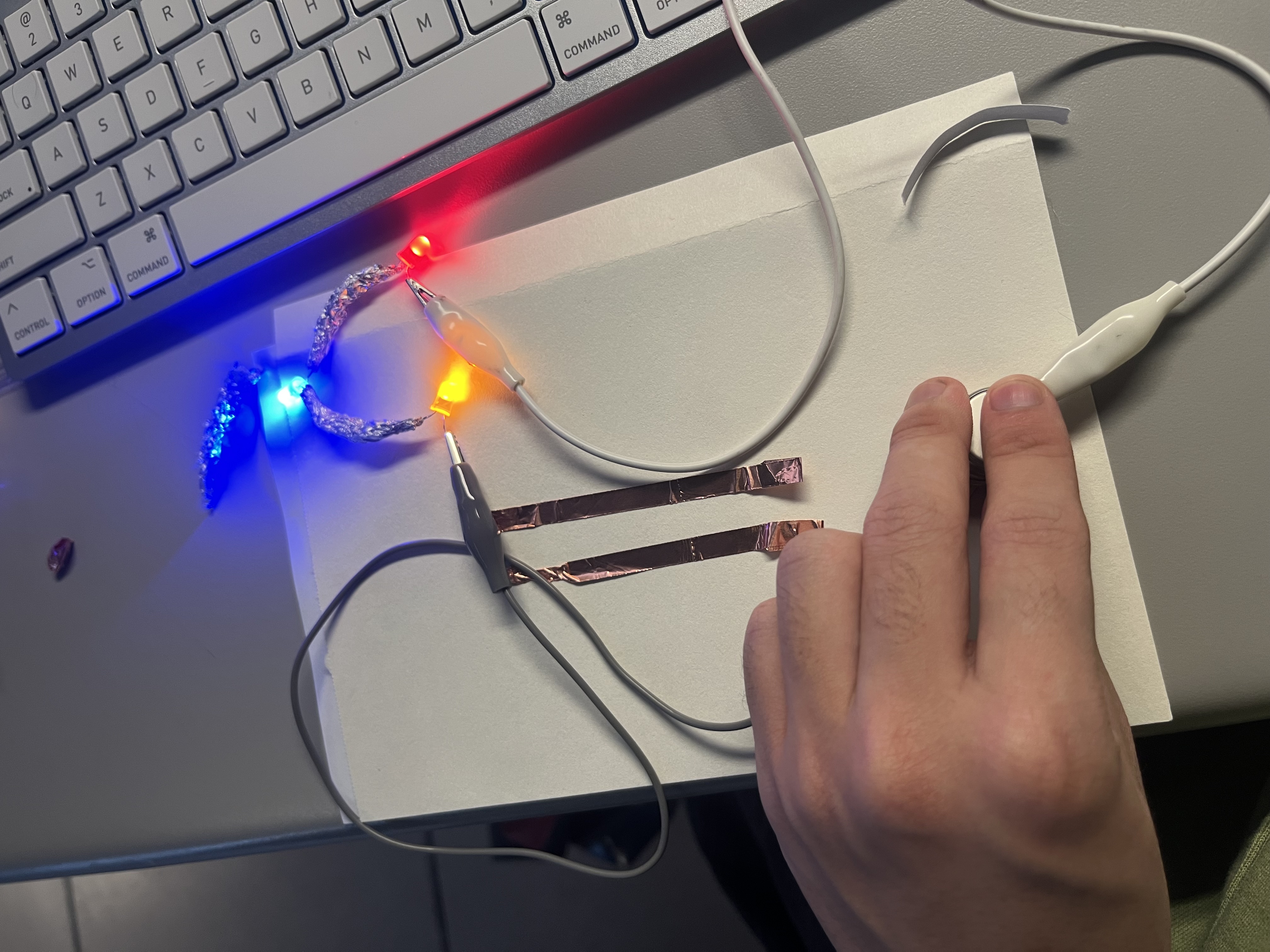 Powering the three-bulb circuit with three batteries, achieving successful activation.