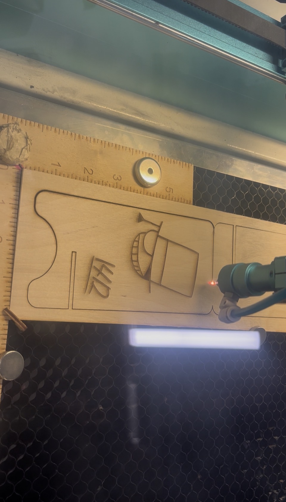 Raw material undergoing laser cutting <a href='https://www.youtube.com/embed/tgbNymZ7vqY' target='_blank'><p>Project Video Link</p></a>