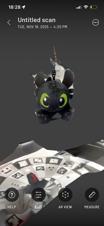 Failed scan object: Rear view of black plush toy